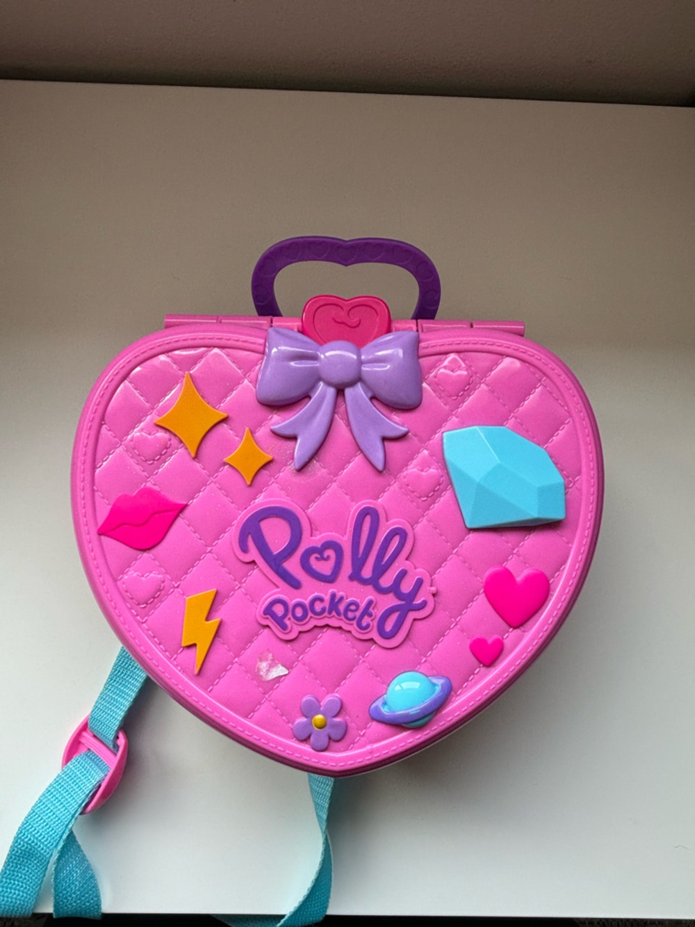 Polly pocket “tiny is mighty” theme park backpack